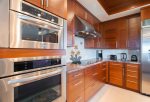The kitchen features all luxury, high-end stainless steel appliances